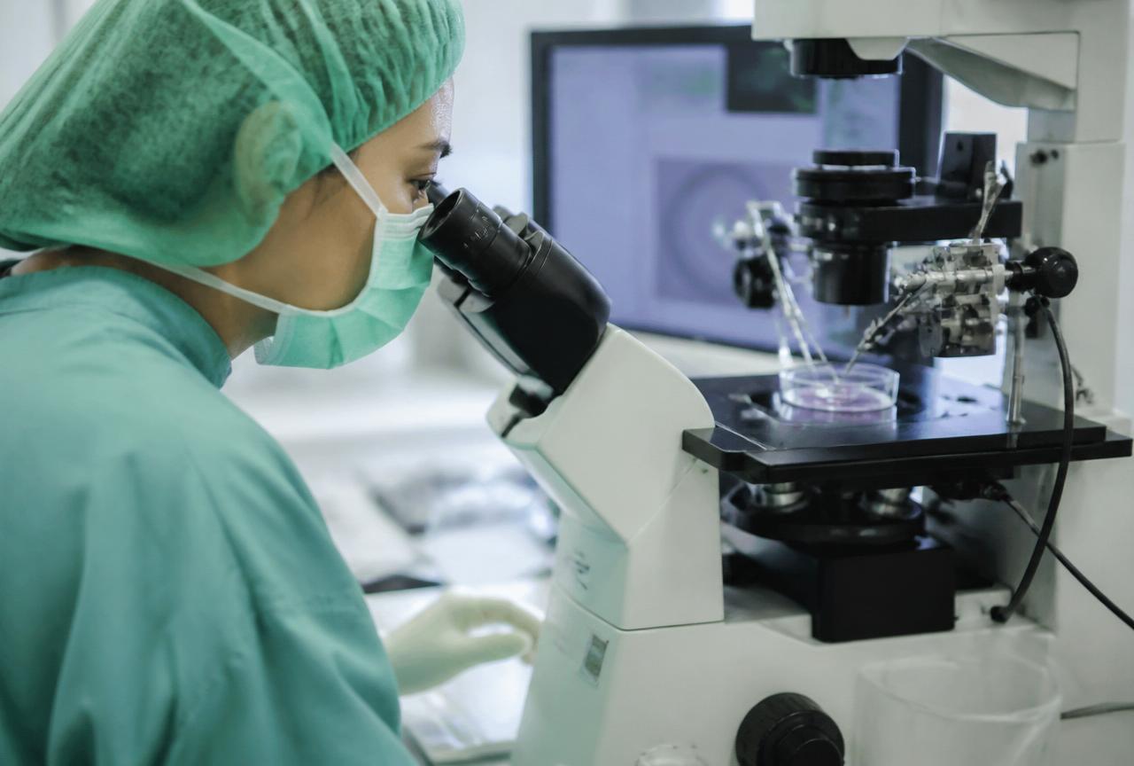 Fertility education – lab technician at microscope